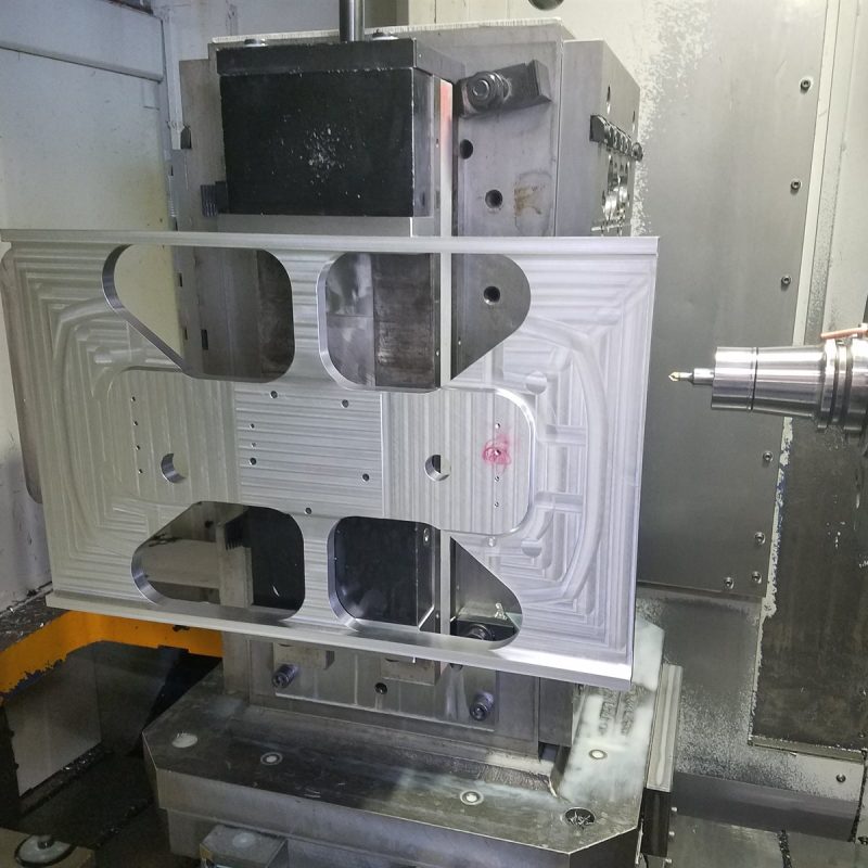 Large machined aluminum plate set up in a Mori Horizontal mill
