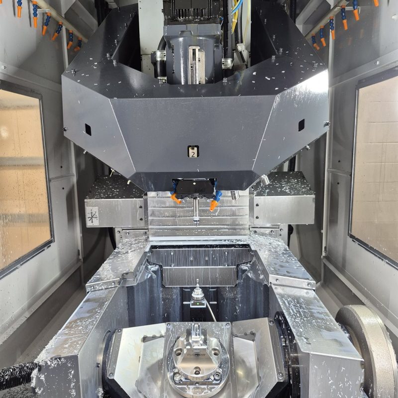Inside view of a 5-axis CNC mill with spindle and rotary table